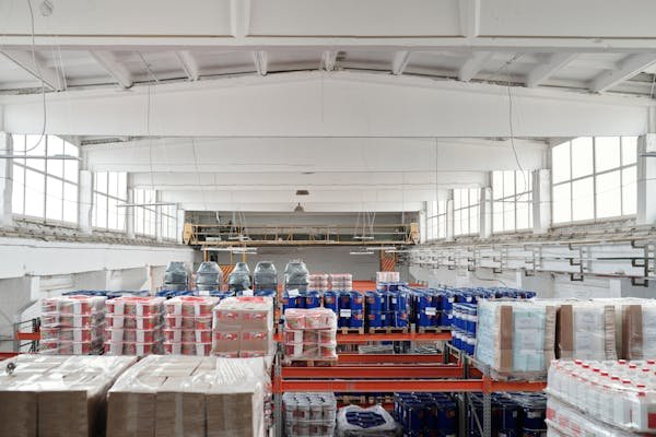 Some systems use cranes to retrieve items from shelves several stories high. Others use shuttles or robots to move goods horizontally and vertically. All of them aim to store more in less space and retrieve items faster than a human ever could.